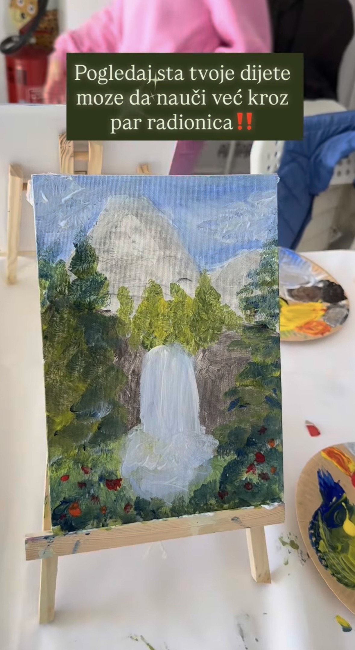 A finished waterfall painting on an easel